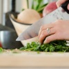 person chopping veggies